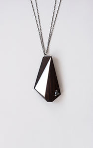 Blackwood Geometric pendant with silver and Hematite details on a light gray background.