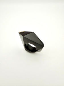 Black geometric ring on a white background