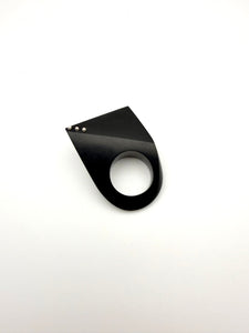 Black geometric wood ring with silver details on a white background