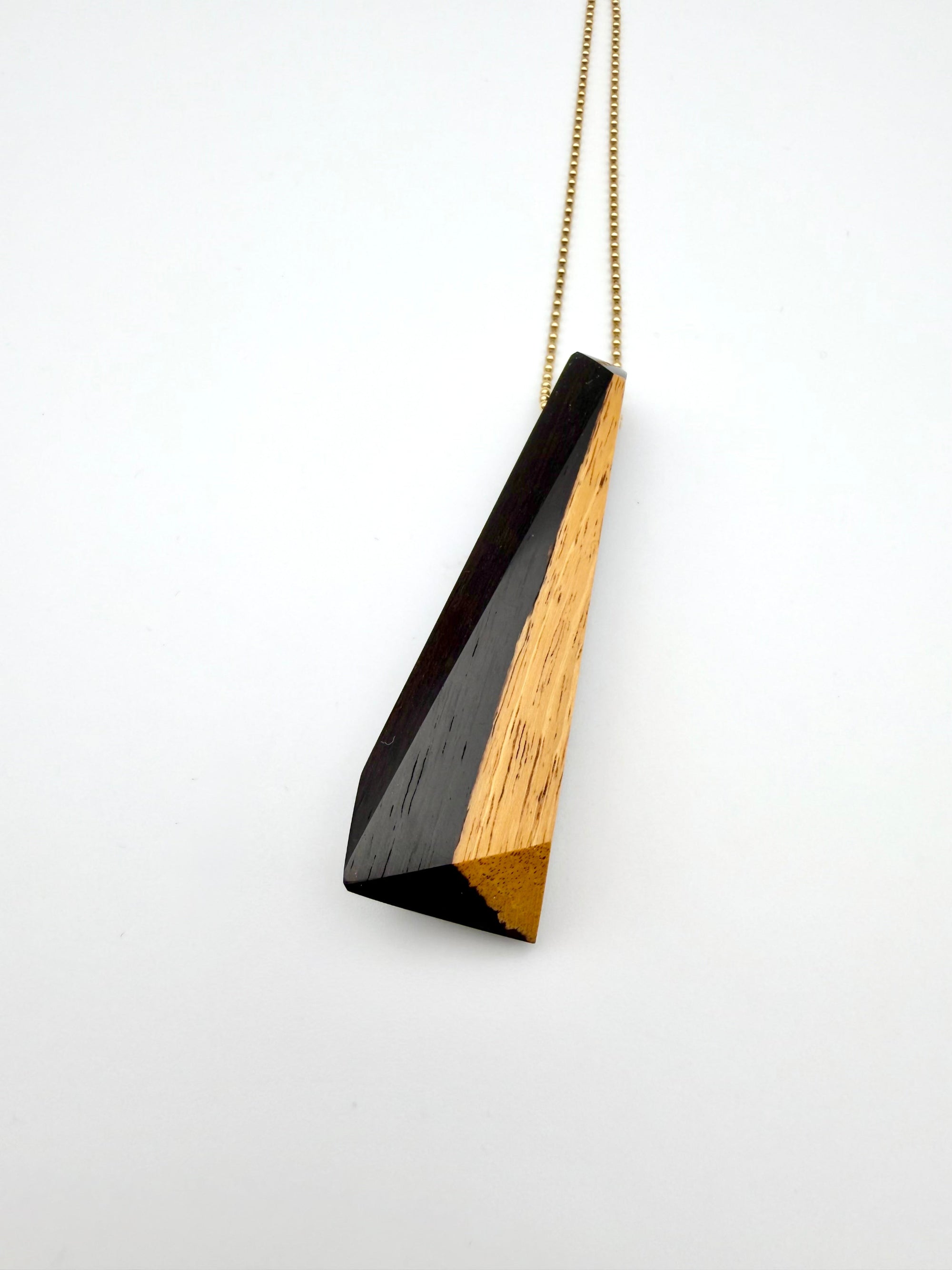 Necklace with a geometric pendant on a white background