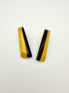 Pair of black and tan long wood stud earrings.