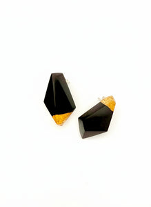 Black and gold wood geometric earrings on a white background