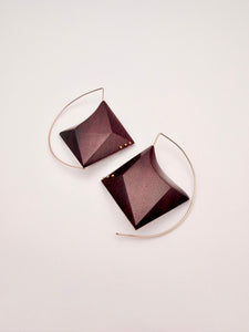 Deep red wood geometric earrings with Gold Filled Details and ear wires on a light background. 