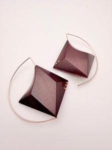 Deep red wood geometric earrings with Gold Filled Details and ear wires on a light background. 