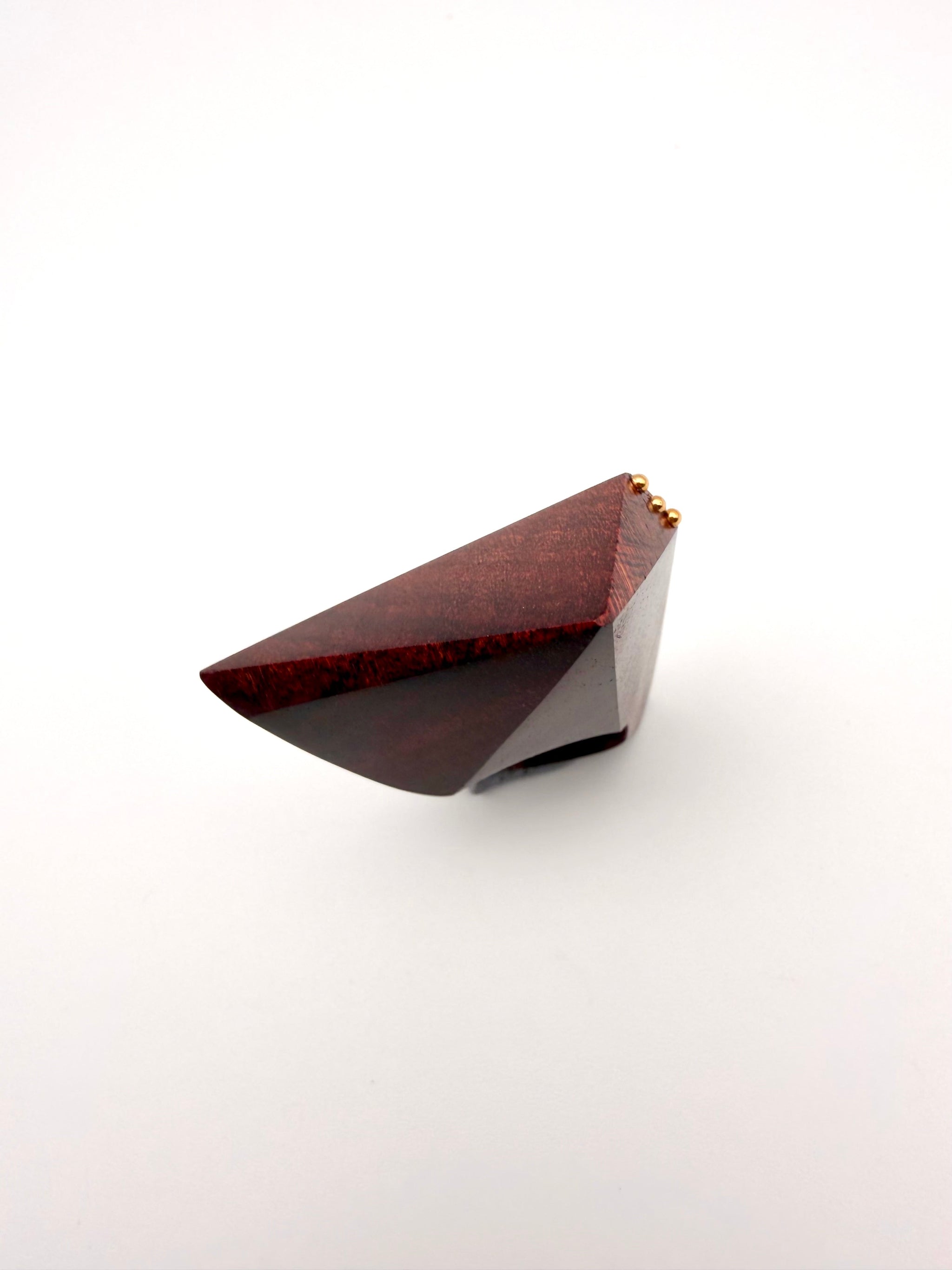 Geometric Wood sculpture ring with top view on white background. 