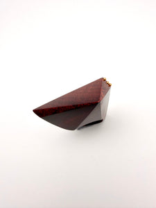 Geometric Wood sculpture ring with top view on white background. 