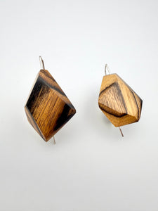 Wooden geometric earrings on a white background