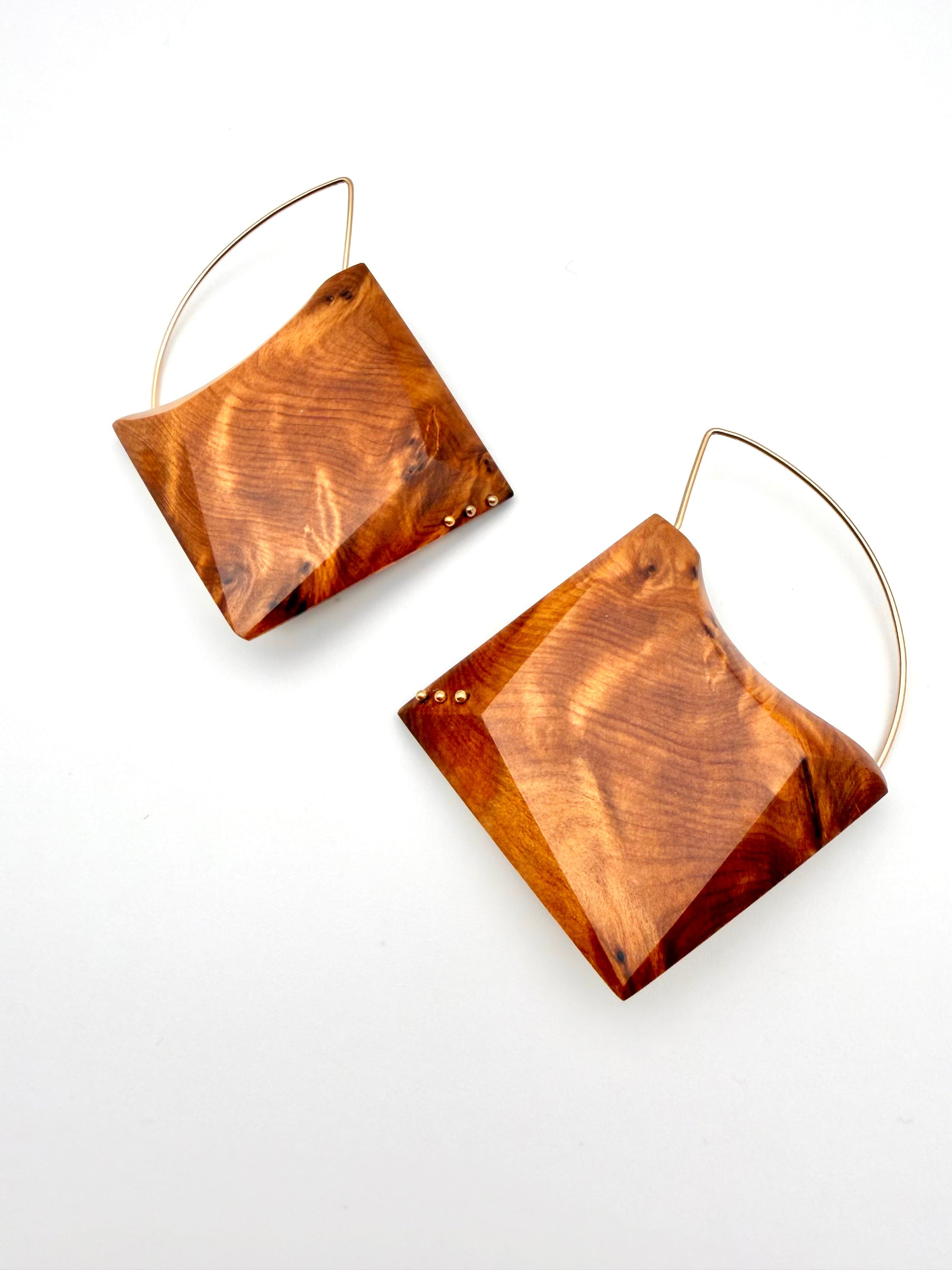 ornate wood grain geometric earrings with Gold Filled details and hoops on white background. 