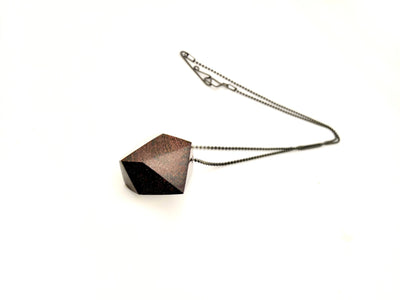 Geometric wood pendant necklace with Oxidized Silver Ball Chain and custom clasp on a white background