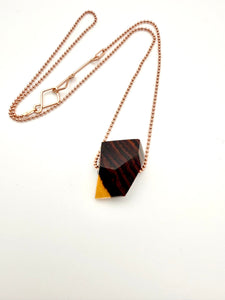 Necklace with geometric wood pendant on a white background, this image shows the back of the pendant on a Rose Gold Ball Chain. 