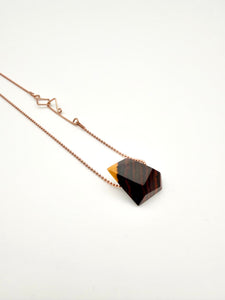 Necklace with a geometric wood pendant with Rose gold ball chain and custom clasp on a white background