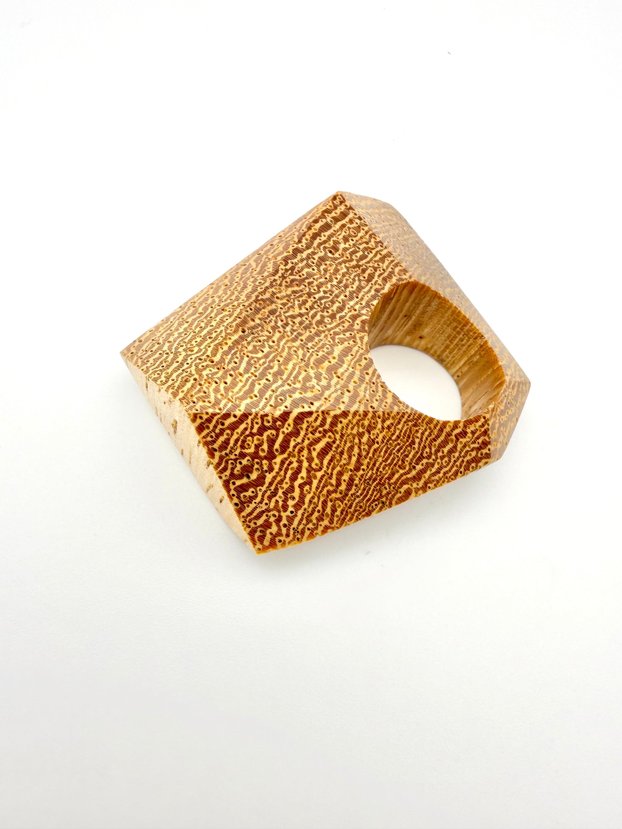 Textured wood ring on a white background