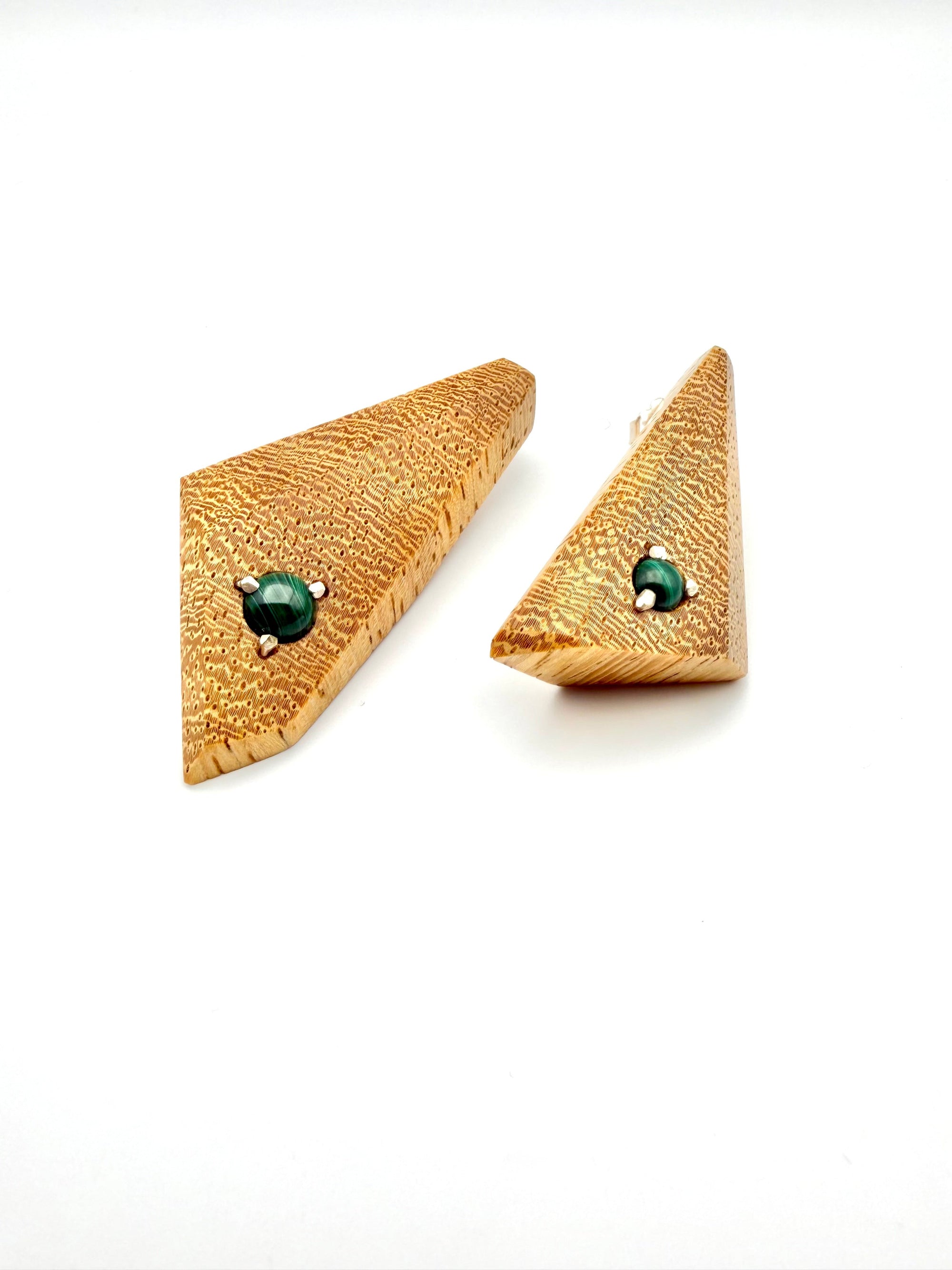 Blonde Lati wood triangle-shaped earrings with Malachite gemstones set with silver on a white background