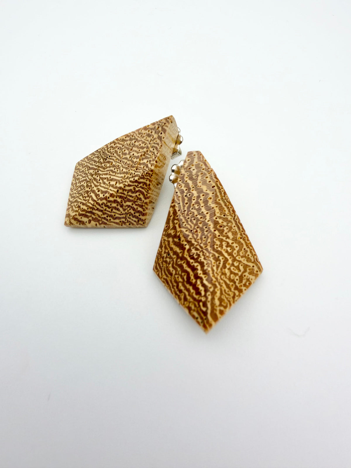 Blonde wood earrings with dramatic end grain. 