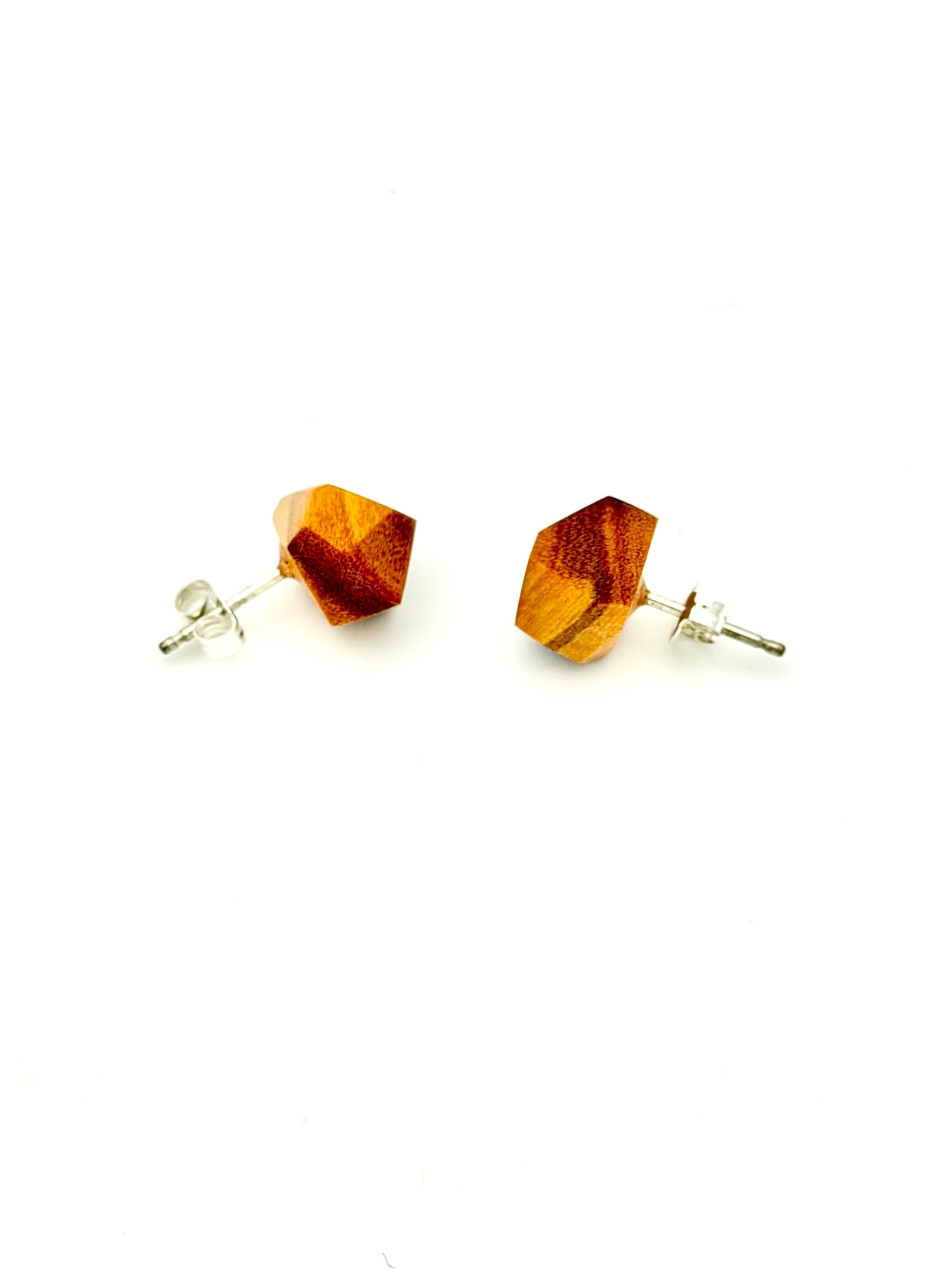 side view of orange wood geometric Stud Earrings with silver posts on white background. 