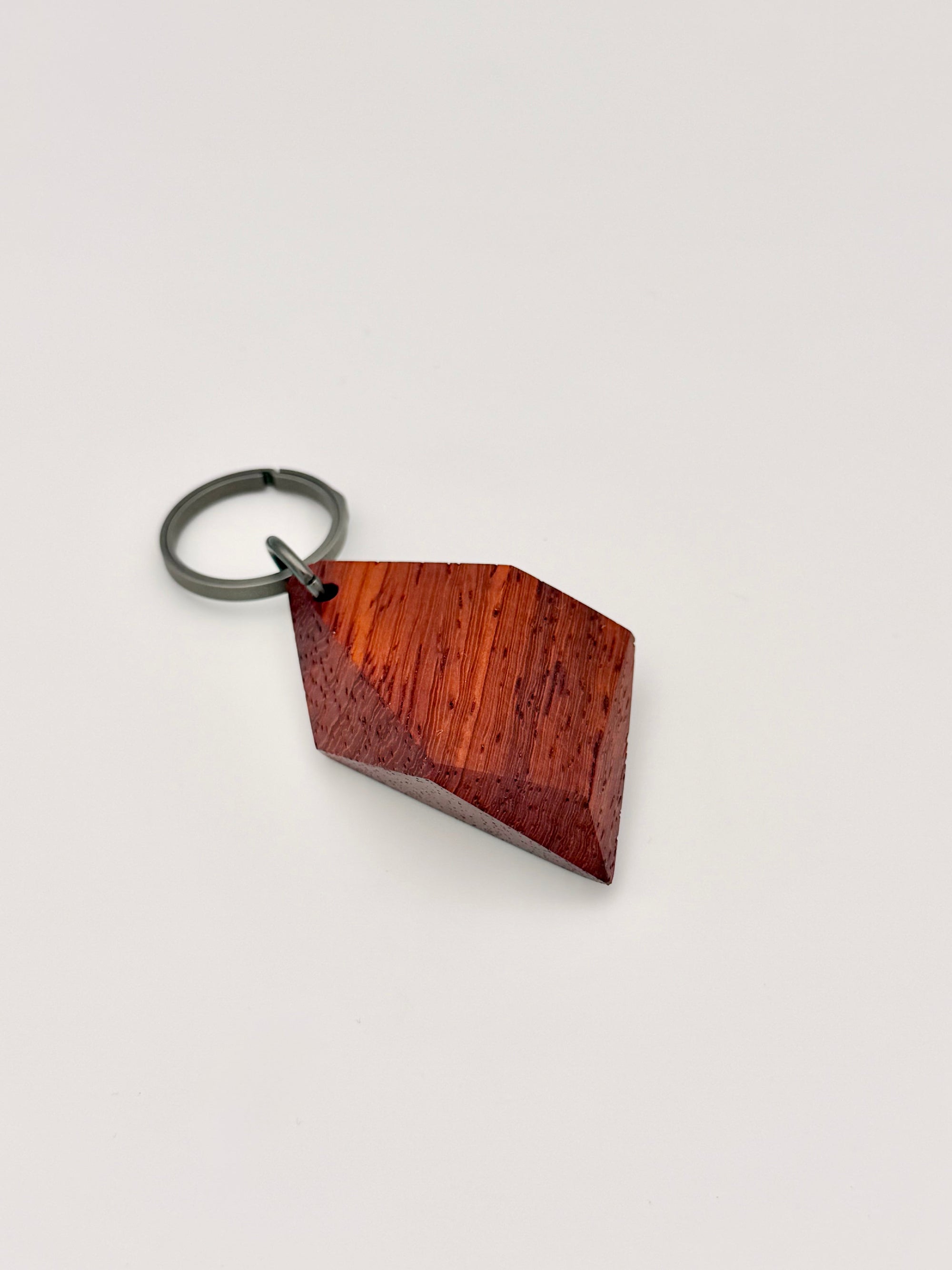 Wooden keychain with geometric design on a white background