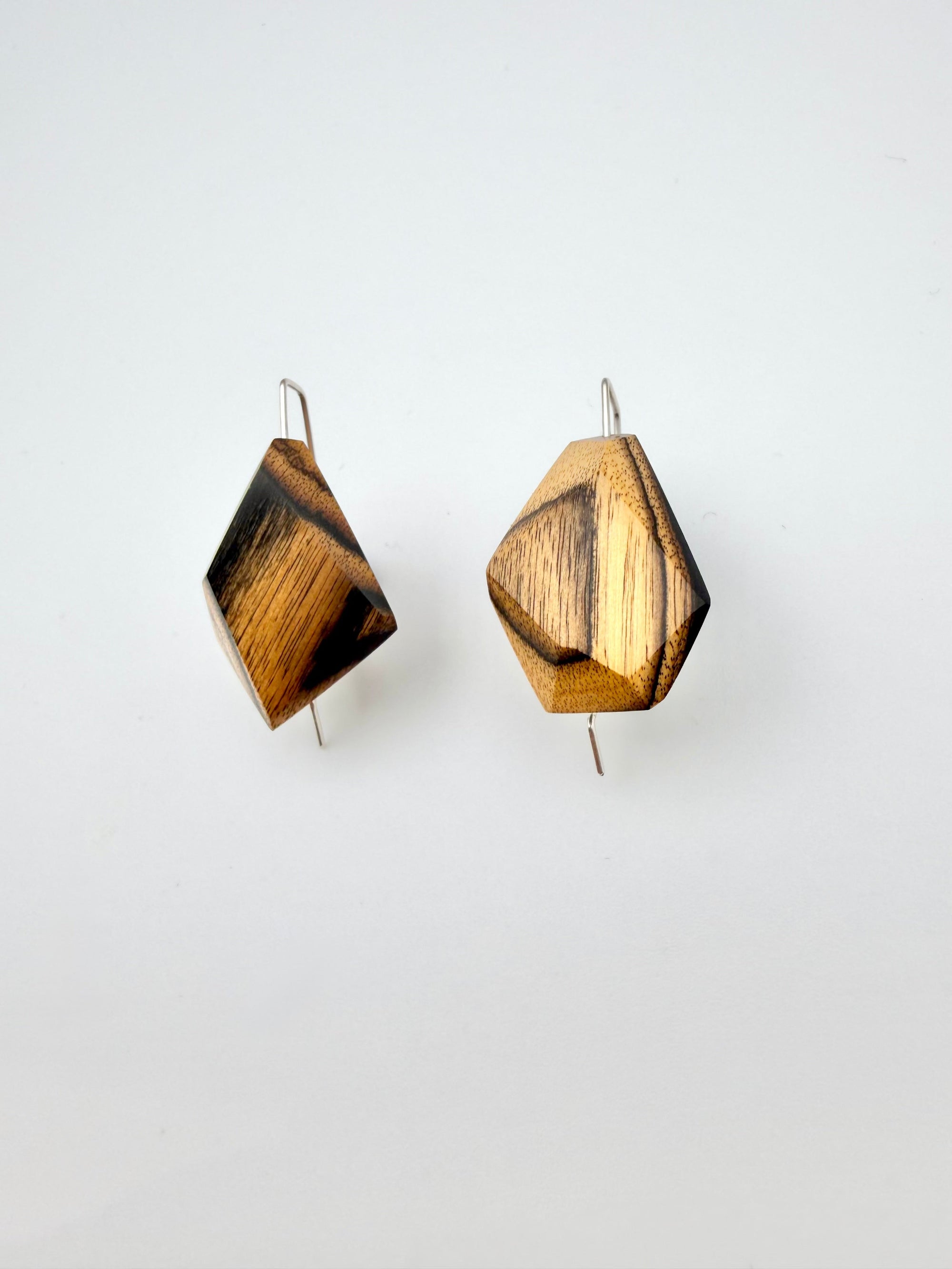 Black & Blonde geometric earrings on a white background
