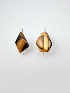 Black & Blonde geometric earrings on a white background