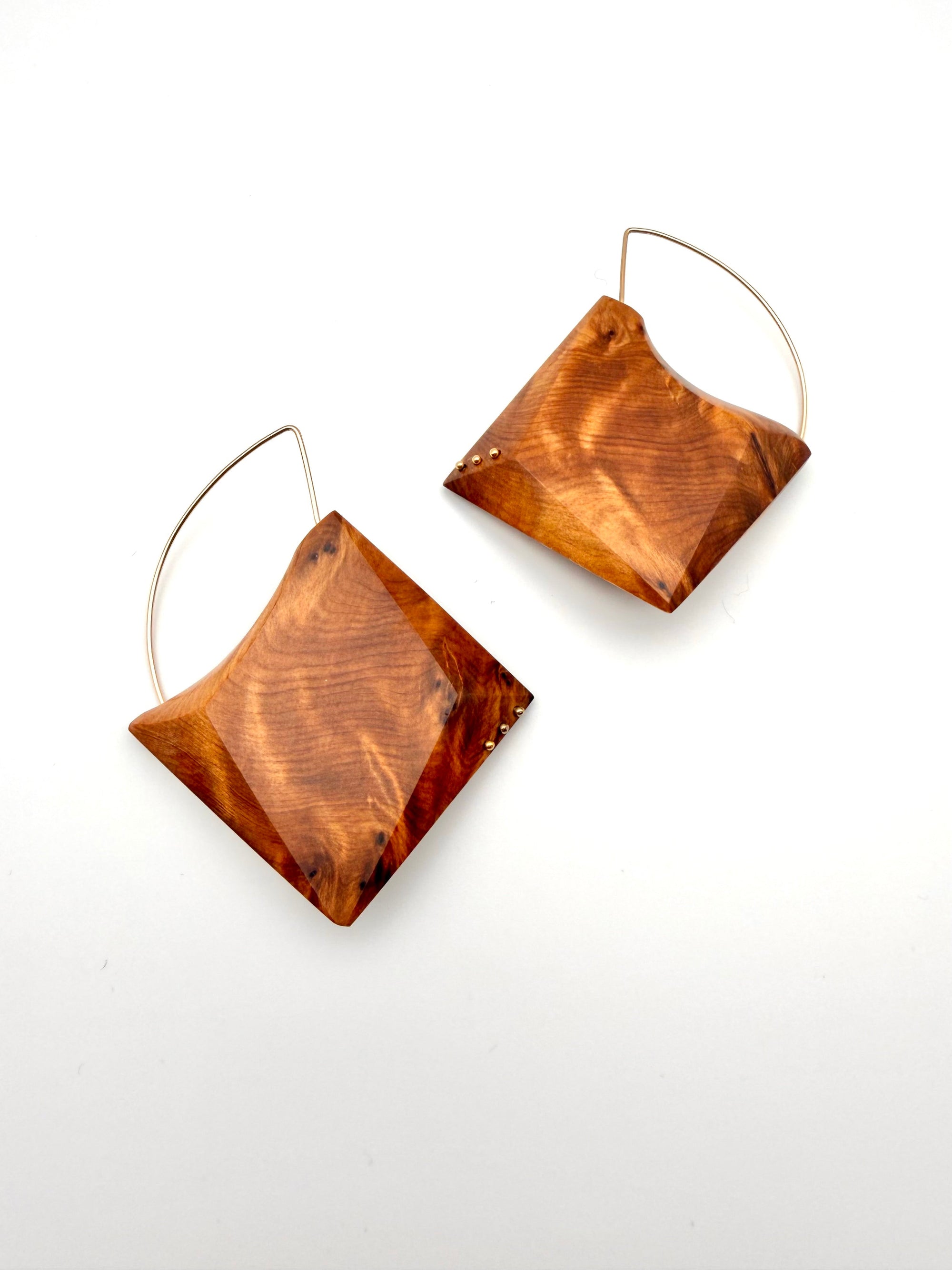 ornate wood grain geometric earrings with Gold Filled details and hoops on white background. 
