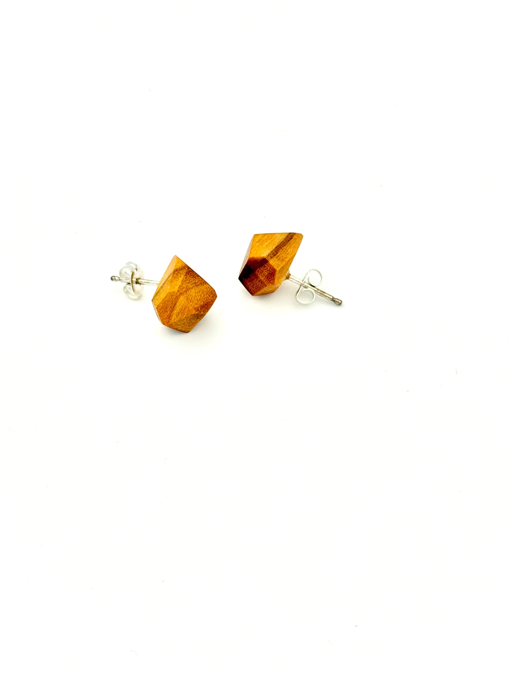 Side angle of orange wood geometric Stud Earrings on white background. 