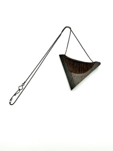 Triangular Wood Pendant on Black Chain with custom clasp on white background. 