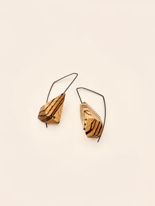 Asymetric Zebrawood geometric drop earrings with oxidized angular hoops and oxidized dot details in wood on white background. 